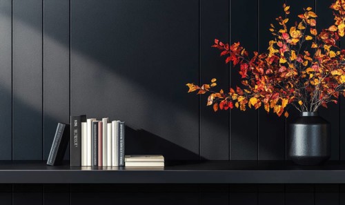 Sleek black table with a couple of books and a vase filled with autumn foliage AI generated