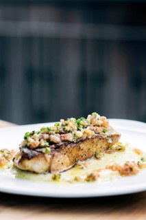 Fresh sea fish fillet with spicy salsa vegetables sauce