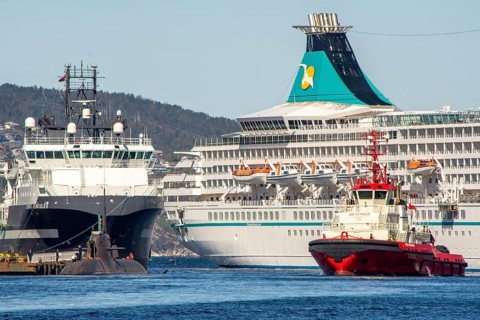 Bergen, Norway, May 2015: Harbor scene in Bergen, Norway, with cruise ship and towing boat and
