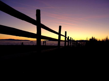 Fence in front of sunset