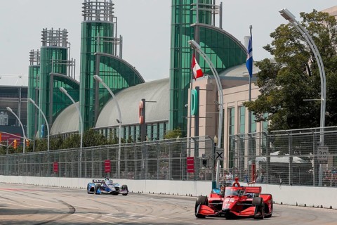 BENJAMIN PEDERSEN (R) (55) of Copenhagen, Denmark runs through the streets during the Honda Indy