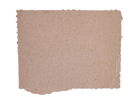 Corrugated kraft cardboard. A piece of torn cardboard isolated on a white background
