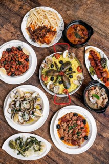 Mixed portuguese traditional rustic tapas food gourmet selection on wood table
