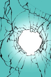 Stained glass with a hole in the middle on a blue background. Texture of black cracks and white