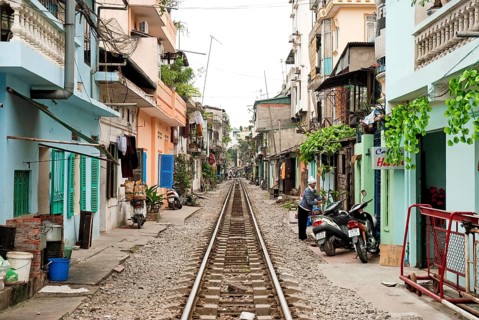 Asian travel tourism holidays vacations tourist east orient oriental modern railway poverty housing