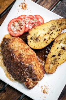 Chicken schnitzel with potato and gravy simple meal