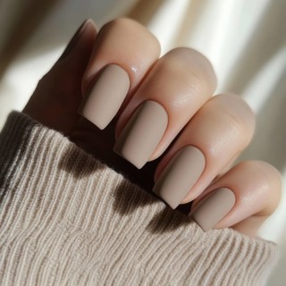 Soft warm taupe nails with a matte finish AI generated