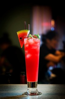 Fresh watermelon juice and vodka mixed cocktail drink at bar at night4