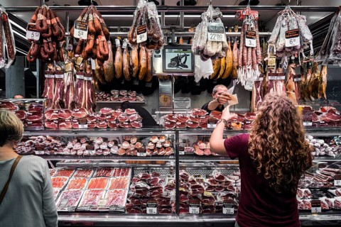 Traditional cured meat and sausage shop in la boqueria market of barcelona spain