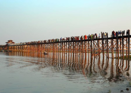 Famous U-Bein teak bridge at sunset on Taungthaman lake in Amarapura, Mandalay division, Myanmar,