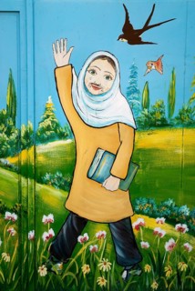 Mural of iranian muslim veiled schoolgirl in yazd iran