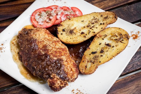 Chicken schnitzel with potato and gravy simple meal