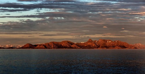 Panoramic view of the mountains on the Norwegian Sea coast at sunrise