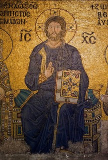 Jesus enthroned above the imperial gate in Hagia Sophia, Istanbul, Turkey, Asia
