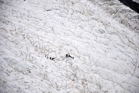 Group of tourists on the Franz Josef Glacier, Westland, New Zealand, Oceania