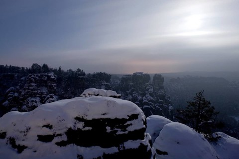 Bastei rock at full moon in winter