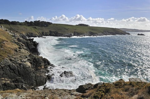 Waves crashing on the rocks of sea cliff at the Pointe du Millier at Beuzec-Cap-Sizun, Finistère,