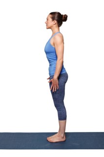 Woman doing Hatha Yoga asana Tadasana, Mountain pose with stretched hands isolated