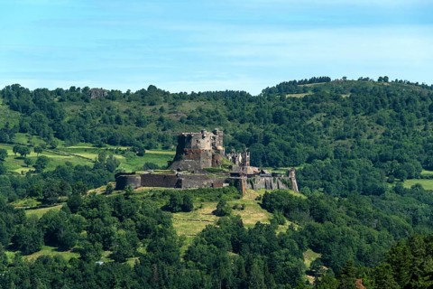 View of the medieval castle of Murol in the Auvergne Volcanoes Regional Natural Park, Puy de Dome,