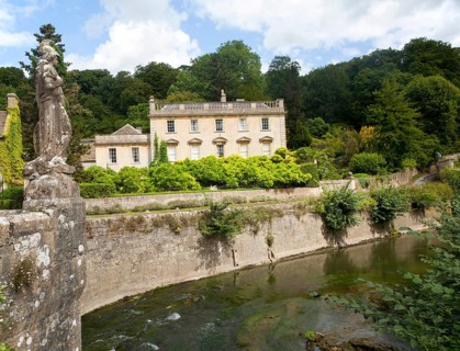 Statue of Britannia on the fifteenth century bridge over the River Frome, Iford Manor, near