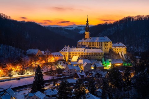 Winter evening in the Müglitz valley, impressively illuminated Weesenstein Castle at the blue hour,