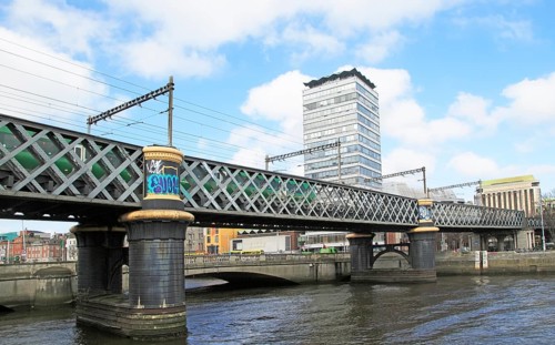 Loopline rail bridge or Liffey viaduct spanning river from Pearse railway station, Dublin, Ireland,