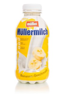 Müllermilch banana flavour in the bottle of the company Theo Müller cropped in front of a white