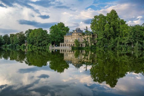 Seeschloss Monrepos is reflected in Lake Eglosheim, Ludwigsburg, Baden-Württemberg, Germany, Europe