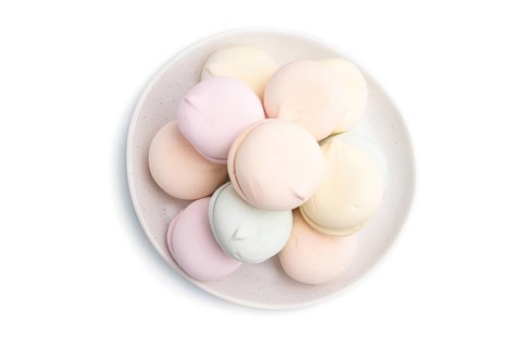 Colored zephyr or marshmallow isolated on white background. Top view, close up
