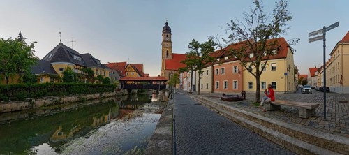 Panorama of the river Vils with the spire of St Martin's Basilica and the historic ship bridge at