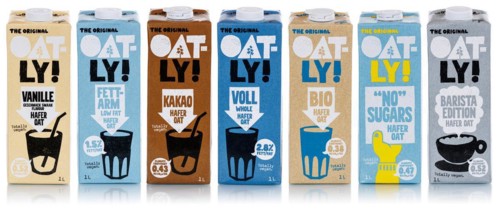 Oatly different types of vegan oat milk cropped against a white background