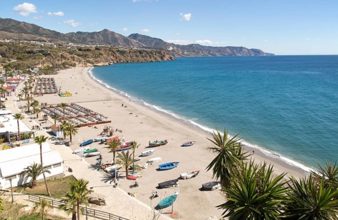 Playa Burriana sandy beach at popular holiday resort town of Nerja, Malaga province, Spain, Europe