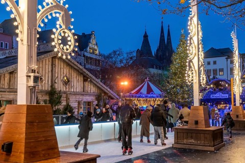 Ice rink at the Christmas market on the Heumarkt in the old town of Cologne, Cologne Cathedral,