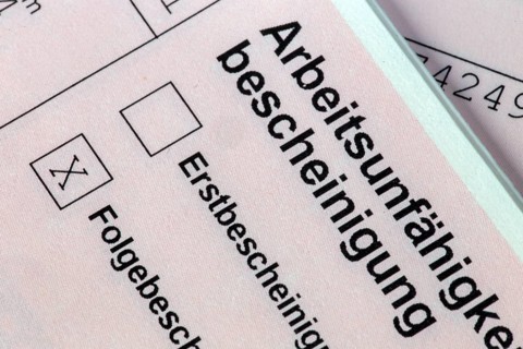 Symbolic image: Close-up of a certificate of incapacity for work