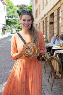 Swedish woman, 39 years old, with a traditional cinnamon bun, Haga neighbourhood, Gothenburg,