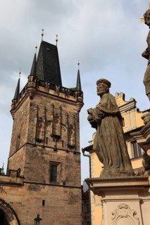 The Saints on Charles Bridge and the Lesser Town Bridge Tower, Prague, Czech Republic, Europe