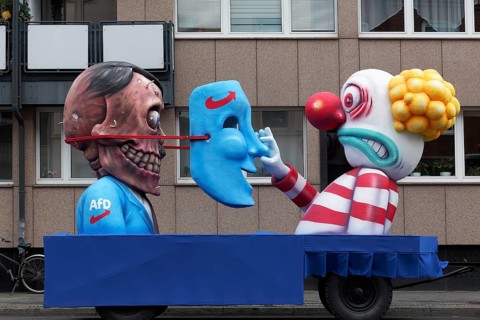 Behind the mask of the AFD is the skull of Hitler, papier-mâché figures, satirical float by Jacques