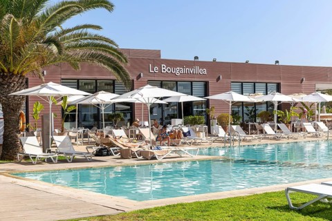 Tourists at swimming pool, Radisson Blu Resort, Taghazout Bay Surf Village, Taghazout, Morocco,