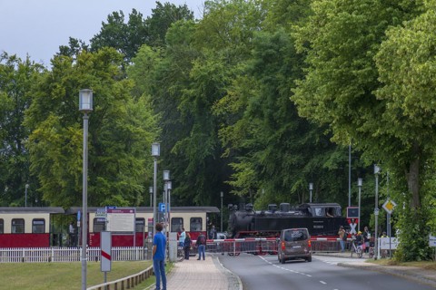 Historic, Mecklenburgische Bäderbahn Molli at the railway crossing in Heiligendamm,
