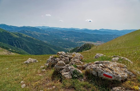 Mountain landscape on the edge of the Pian Grande di Castelluccio di Norcia plateau in the Monti