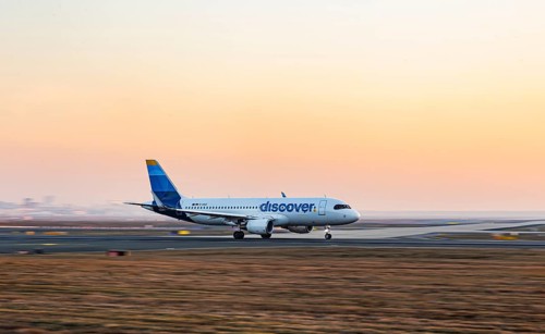 Discovery Airlines aircraft taking off in the early morning, new design, aircraft registration: