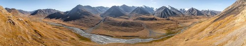 Aerial view, Burkhan mountain valley with meandering river, barren dramatic mountain landscape,