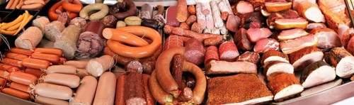Panoramic picture of a sausage counter in a butcher's shop