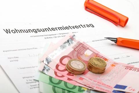 A rental agreement with euro banknotes and coins, studio