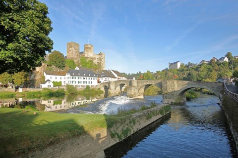 Old Lahn bridge built 1448 with castle built 12th century, Lahn valley, reflection, weir, historic