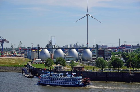 Europe, Germany, Hamburg, Köhlbrandhöft sewage treatment plant, view of the digestion towers, Elbe