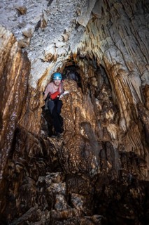 Woman exploring stalactite cave, Terciopelo Cave, Barra Honda National Park, Costa Rica, Central