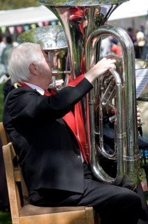 Musicians in a brass band perform during a country fair at Helmingham Hall, Suffolk, England,