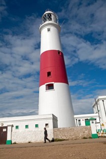 Red and white lighthouse on the coast at Portland Bill, isle of Portland, Dorset, England, United