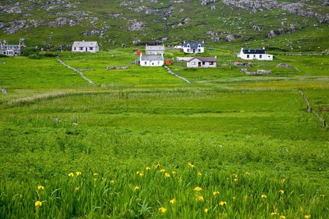 Landscape of countryside and croft houses in the rural settlement of Baile na Creige, Borgh, Barra,